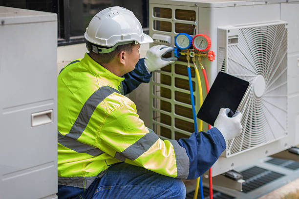 Professional Heat Pump Repair technician working in Summerfield, FL